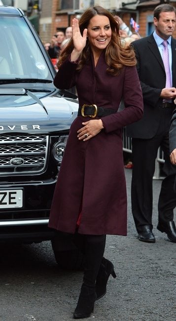 Kate Middleton wears an aubergine coat of her own design