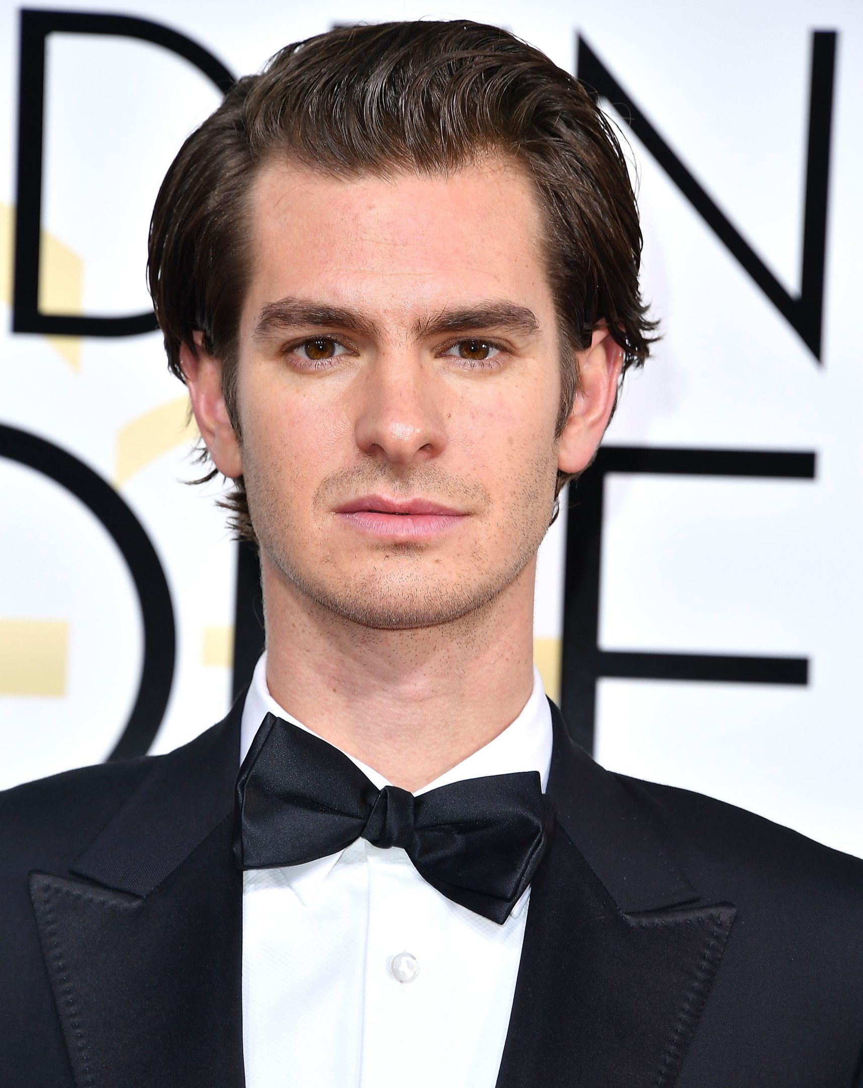 Here's Why Andrew Garfield Kissed Ryan Reynolds At The Golden Globes -  FASHION Magazine