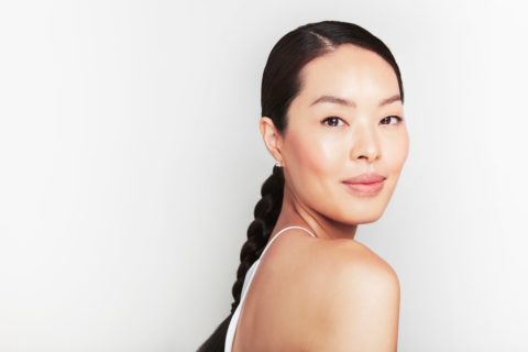 Woman with low braided ponytail