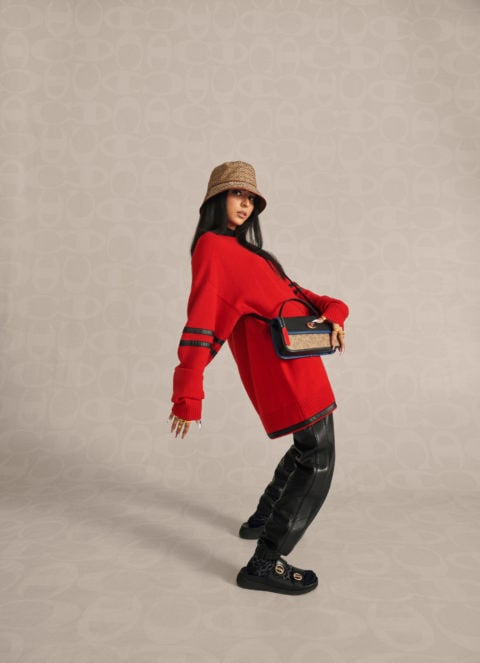 TikTok creator Maha Gondal poses in an image from the Coach x Champion collection campaign