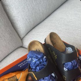 A pair of 'Birkinstock' sandals made out of an Hermès bag