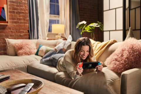 A photo of Annie Murphy playing Nintendo Switch