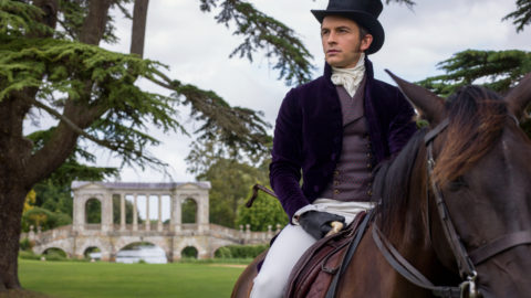 Jonathan Bailey as Anthony Bridgerton, on horseback looking off into the distance, in episode 101 of Bridgerton