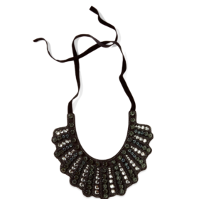 A beautiful black bib-style necklace from Banana Republic that is adorned with gems on the front