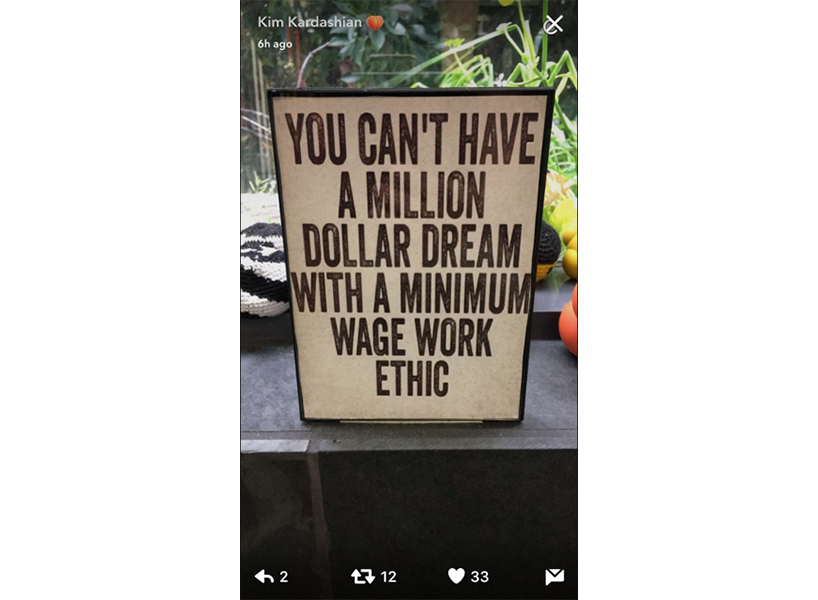 Kim Kardashian Snapchatted a sign that read "You Can't Have A Million Dollar Dream With A Minimum Wage Work Ethic"