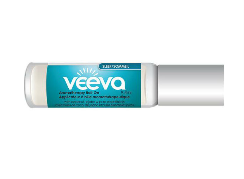 Glass bottle of Veeva roll-on oil. It has a teal label.