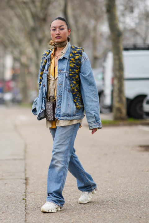 woman in jean jacket yellow collared top