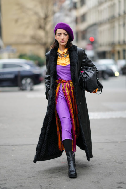 woman in purple dress purple beret black leather coat