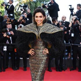 deepika padukone in a louis vuitton dress with large shoulders