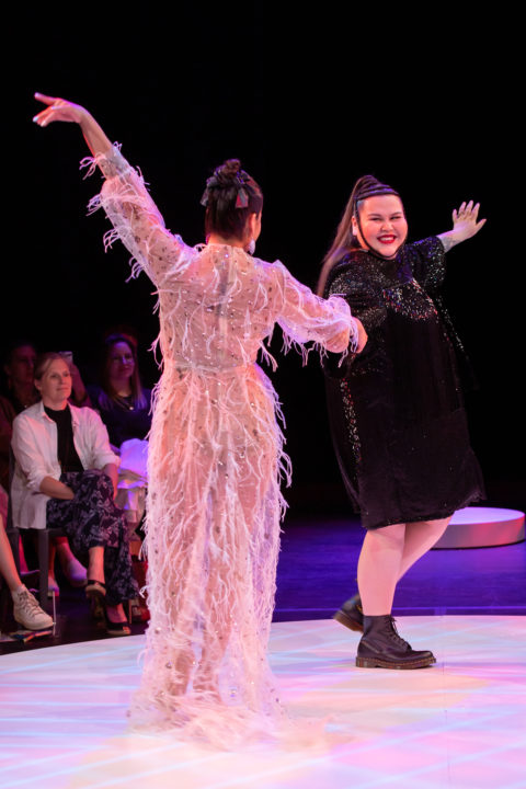 two people dance on the runway at Indigenous fashion arts festival 2022