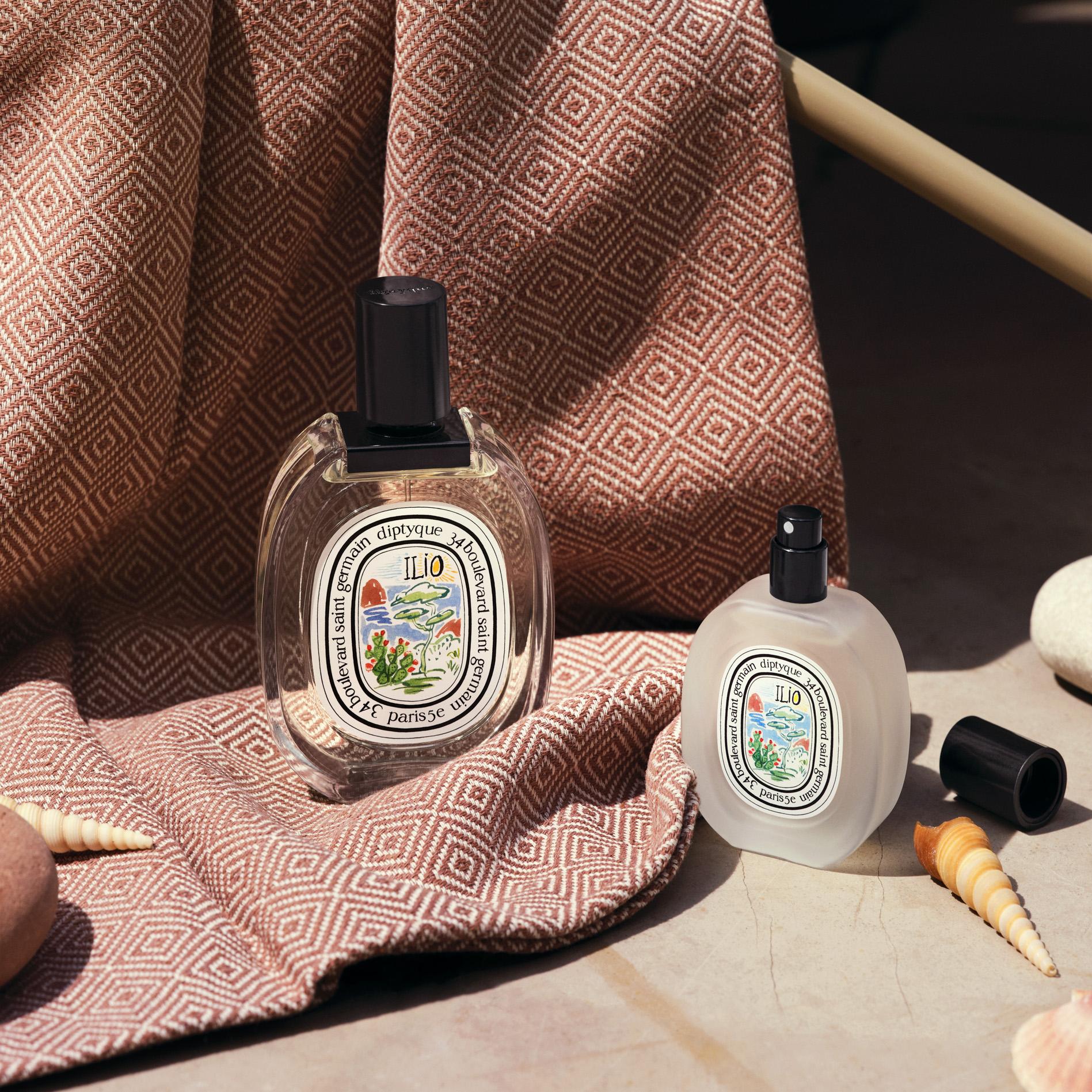 Two bottles of Diptyque perfume