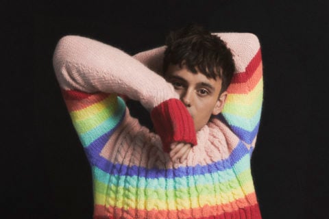man in a rainbow coloured sweater part of Ami Paris pride collection