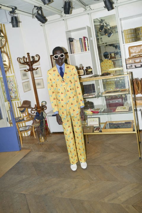 a yellow pattenered suit from the gucci: ha ha ha collection