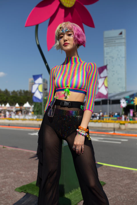 woman with multicoloured hair and top inspo for what to wear to pride 2022