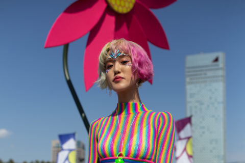 woman with multicoloured hair and top inspo for what to wear to pride 2022