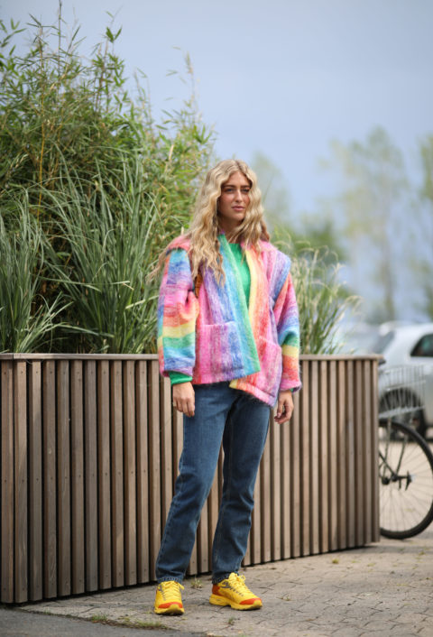 woman with a rainbow jacket