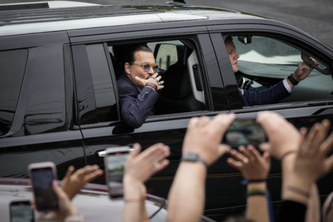 johnny depp waving to fans outside courtroom for trail against amber heard