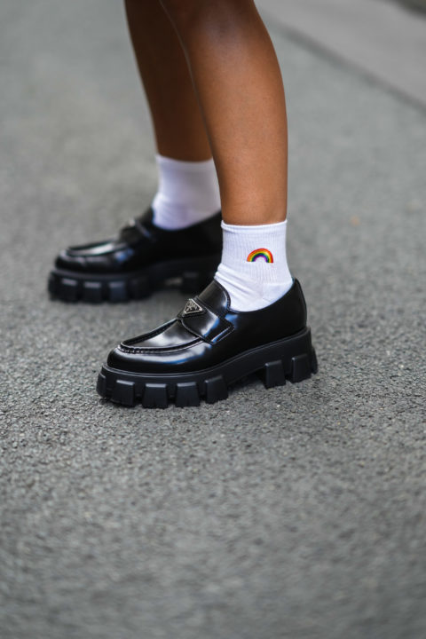 black mary jane style shoes with white socks that feature a small rainbowinspo for what to wear to pride 2022