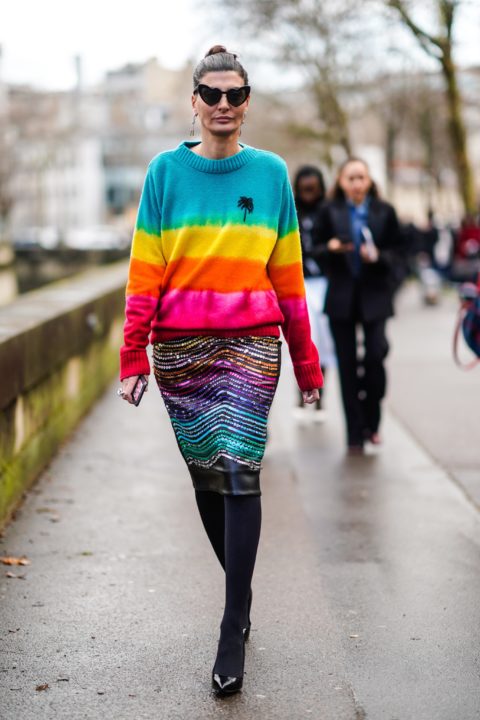 woman in a rainbow sweater with a rainbowskirt