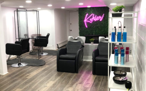 Kuhl.er Bar Inside a curly hair salon in Toronto.The salon is seen empty with two chairs for him by the wash station