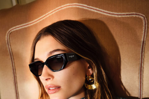 hailey rhode beiber wearing sunglasses and a blue texture turtleneck