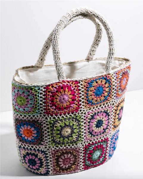 A colourful patchwork crocheted tote bag.