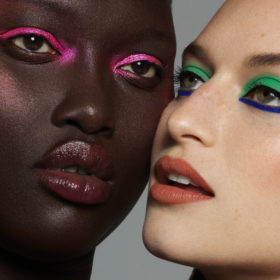 Two models wearing colourful eyeliner from Haus Labs