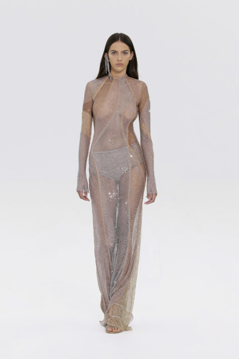 Model walking in mesh see-through Fendi dress