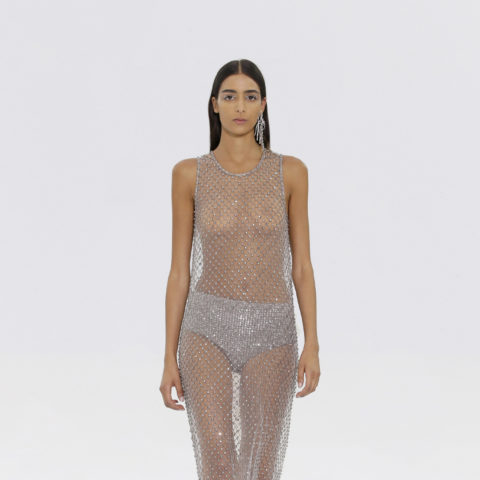 Model walking in mesh see-through Fendi dress with exposed flat stomach for haute couture week fall 2022