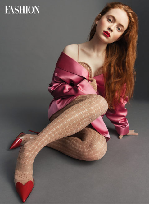 sadie sink in tights, pink heels, and a pink silk dress