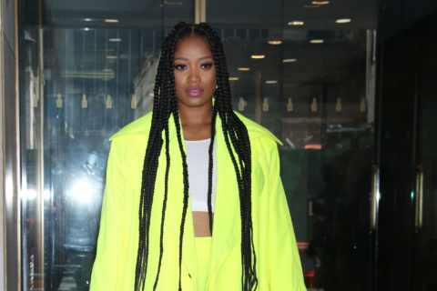 keke palmer wears neon green pants suit with cropped white tank and long braids