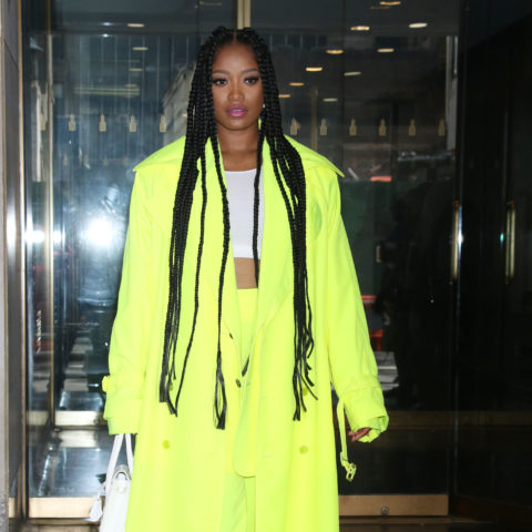 keke palmer wears neon green pants suit with cropped white tank and long braids
