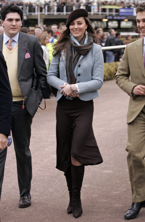 kate middleton walking down the street with two men wearing a brown beret, brown skirt and blue and brown scarf with blue cropped jacket