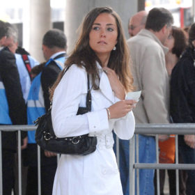 kate middleton in 2000s at princess diana concert with white dress black bag and black boots