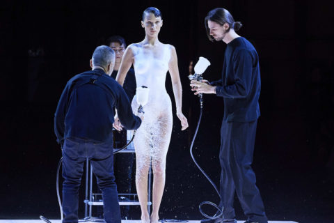 Bella Hadid having dress spraypainted on at Coperni Spring 2023