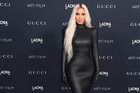 Kim Kardashian wears a form-fitting black latex turtleneck dress to the 2022 LACMA gala
