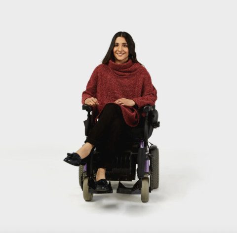 woman in a wheelchair wearing IZ Adaptive