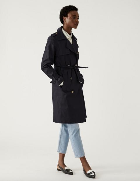 Woman wearing M&S trench coat