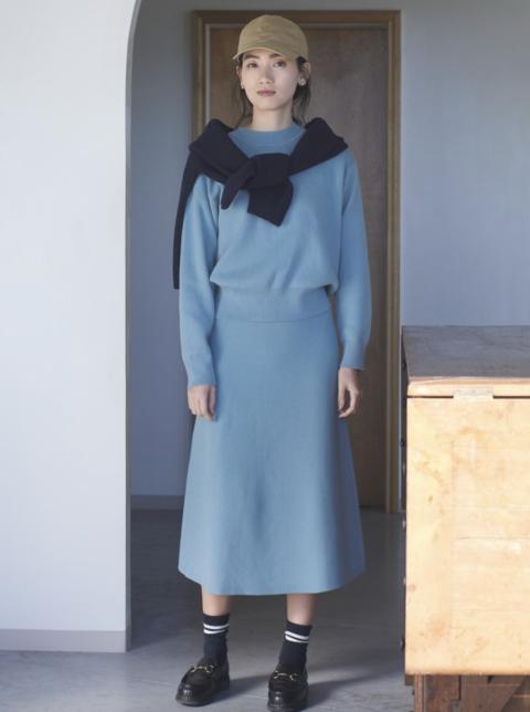 Woman wearing blue Uniqlo skirt set