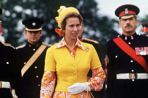 princess anne wears an orange floral dress and yellow cardigan