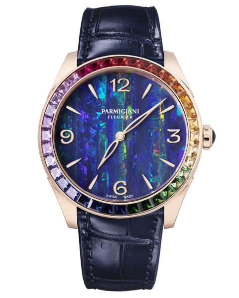 rainbow watches: a watch with a dark opal face with rainbow gems lining the bezel