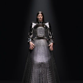 A model in a metal-looking dress at the Balenciaga Fall 2023 couture show