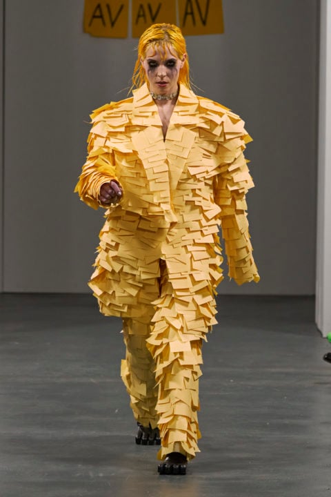 Model walking in a Post-it suit at Avavav Milan Fashion Week