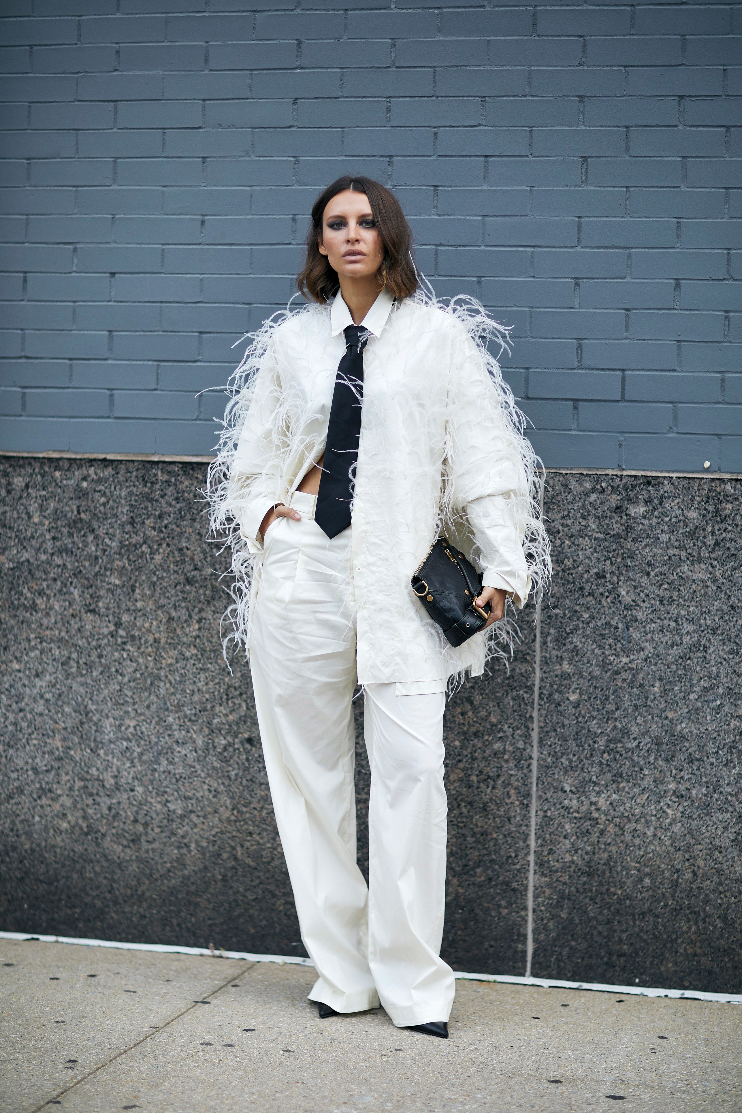 Woman in a chic feather jacket